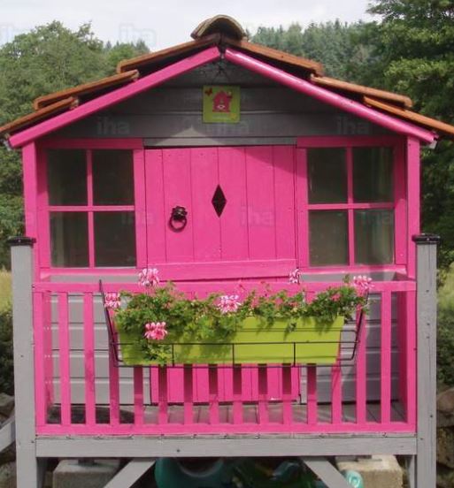 A image of a pink reused shed, will a pink wooden finish